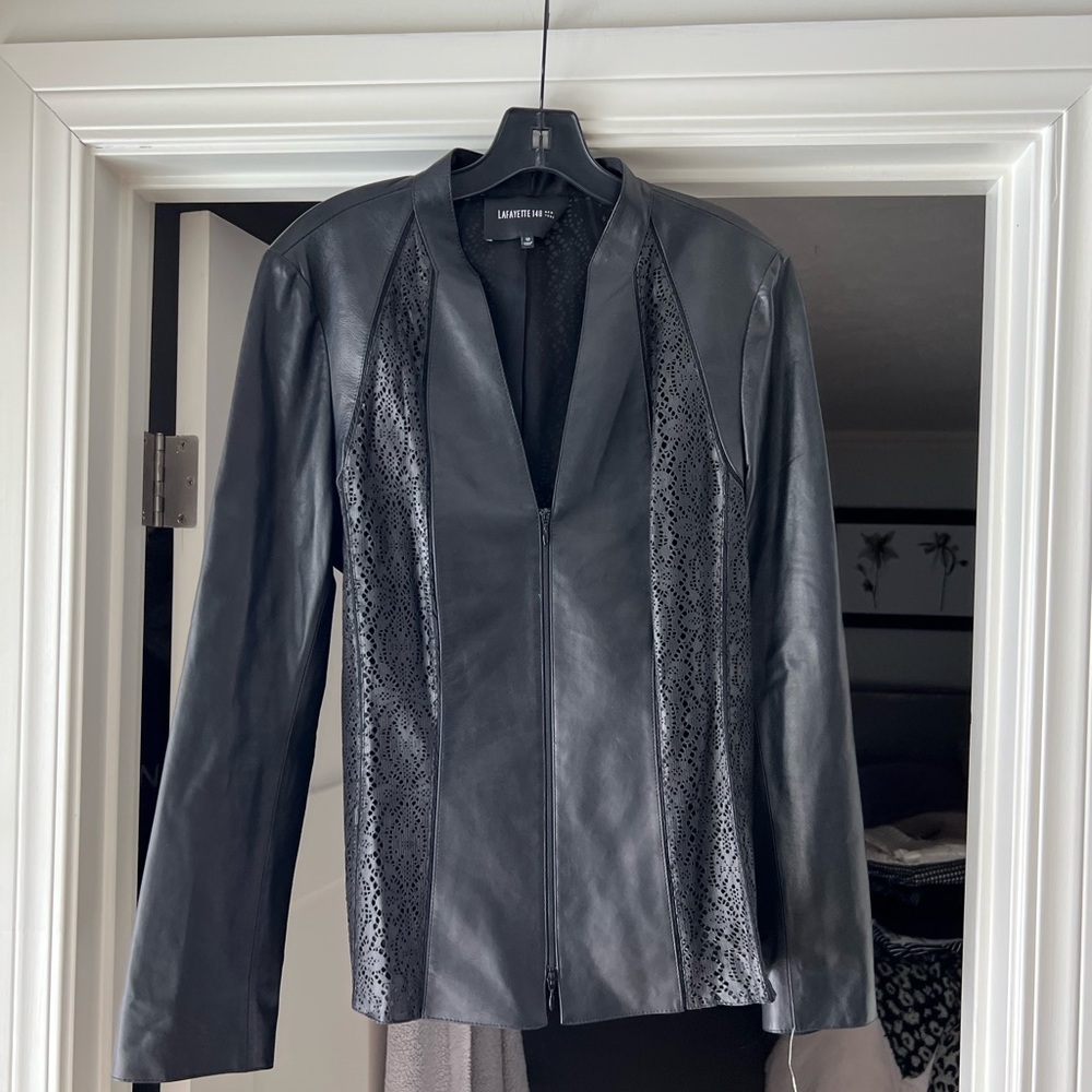 Omg! I loved this so much! But didnt fit!! Real leather!